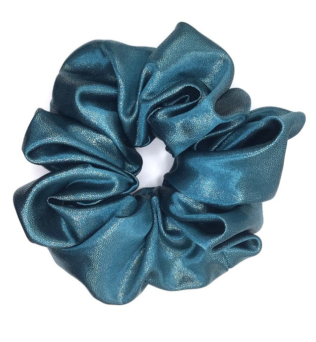 An XXL scrunchie in a sparkly blue stretchy fabric, perfect for adding a touch of glam to any hairstyle.
