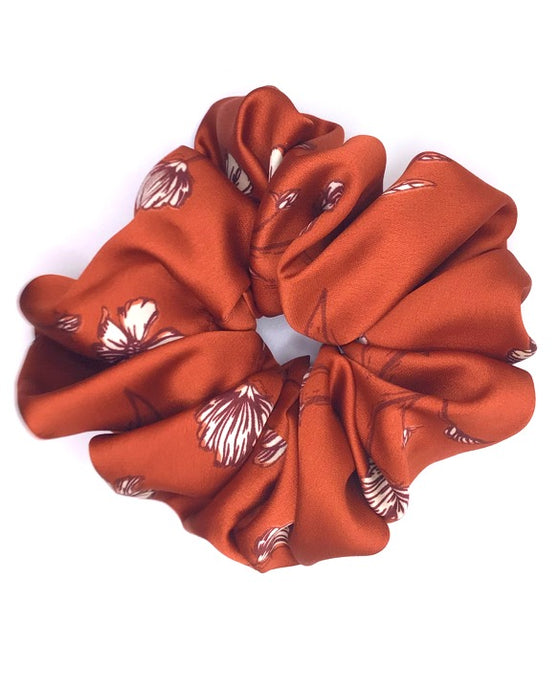 XXL satin scrunchie in burnt orange with a floral sketch design, perfect for adding a pop of color and elegance to any hairstyle.