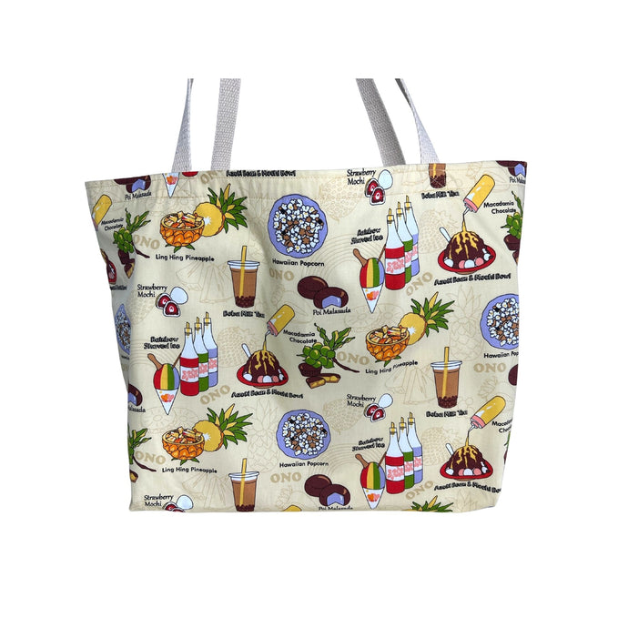 A large beige tote bag with colorful illustrations of Hawaiian local favorites including boba tea, shave ice, strawberry mochi, poi malasada, ling hing pineapple, and Hawaiian popcorn.
